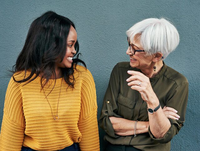 Older woman having a friendly conversation with a younger woman