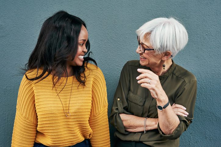 Older woman having a friendly conversation with a younger woman