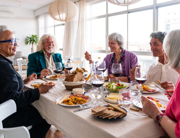 a group of friends enjoying a dinner together in well-appointed settings